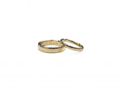 2 wedding rings 9ct Yellow Gold hammered and smooth brushed with date engraved on a white background