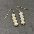 9ct Yellow Gold Earrings wih Cultured pearl Cornish jewellery on slate background