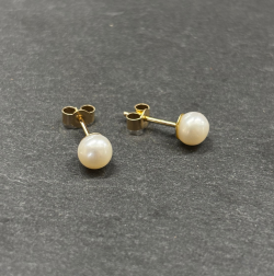 9ct Yellow Gold Earrings wih Cultured pearl Cornwall Jewellery On slate background