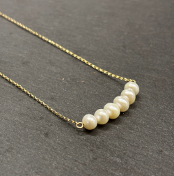 9ct Yellow Gold Necklace with Cultured pearls Cornwall Jewellery on slate background